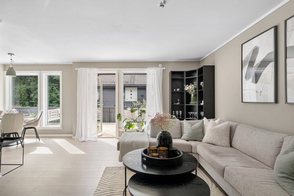 pexels-photo-19899070 Stylish living room with contemporary furniture and ample natural light.